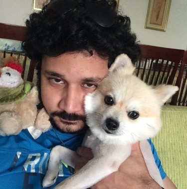 Vishnu posing with his pet dog