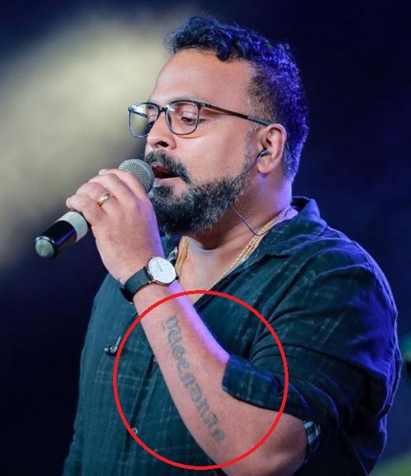 Yugendran's tattoo on his left arm