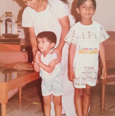 A childhood picture of Vineeth Sreenivasan with his mother and younger brother