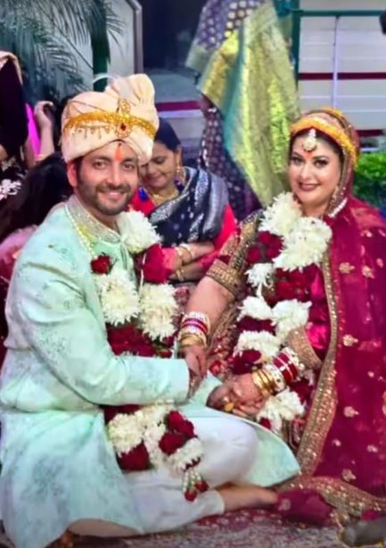 A picture of Vineet Raina and Apeksha Raina on their wedding day