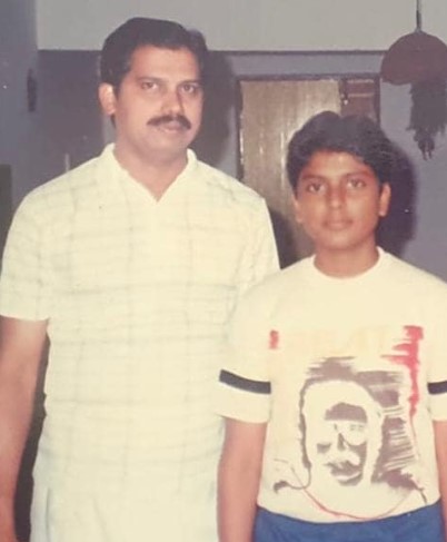 A young Narain Ram posing with his father