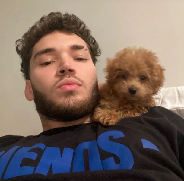 Adin Ross with his pet dog