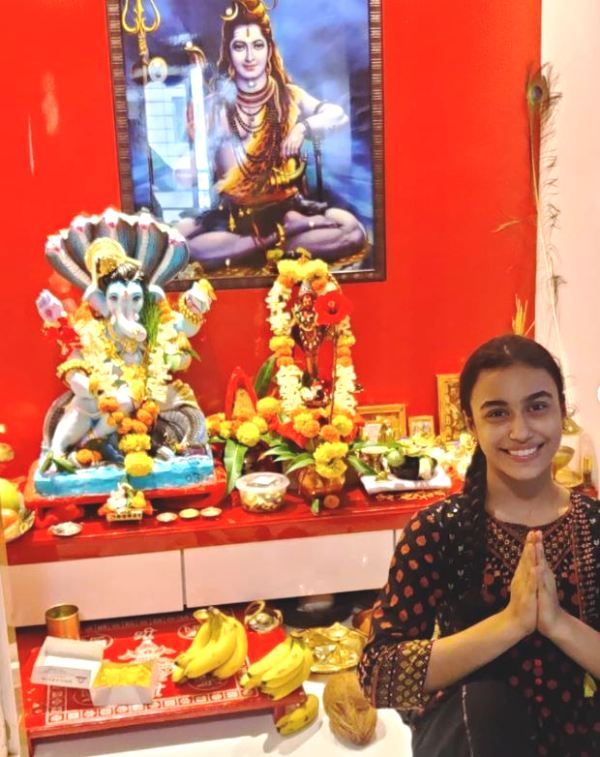 Adrija Sinha worshipping at her home