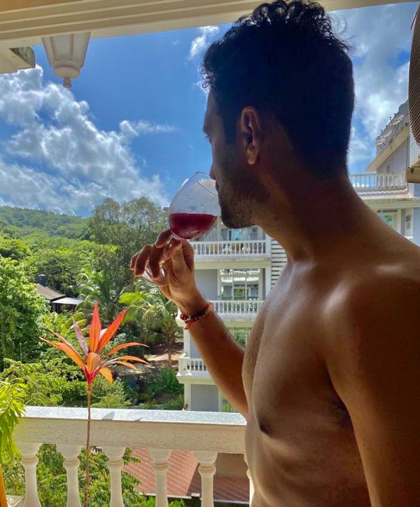 Arjun Aneja drinking wine