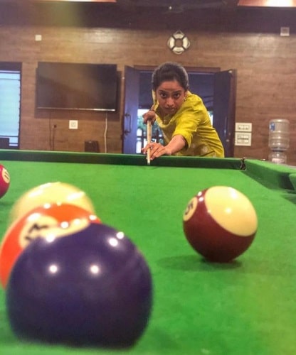 Gauthami Nair playing pool