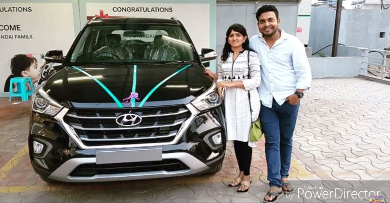 Getup Srinu and his wife, Sujatha, posing with their Hyundai Creta in 2018