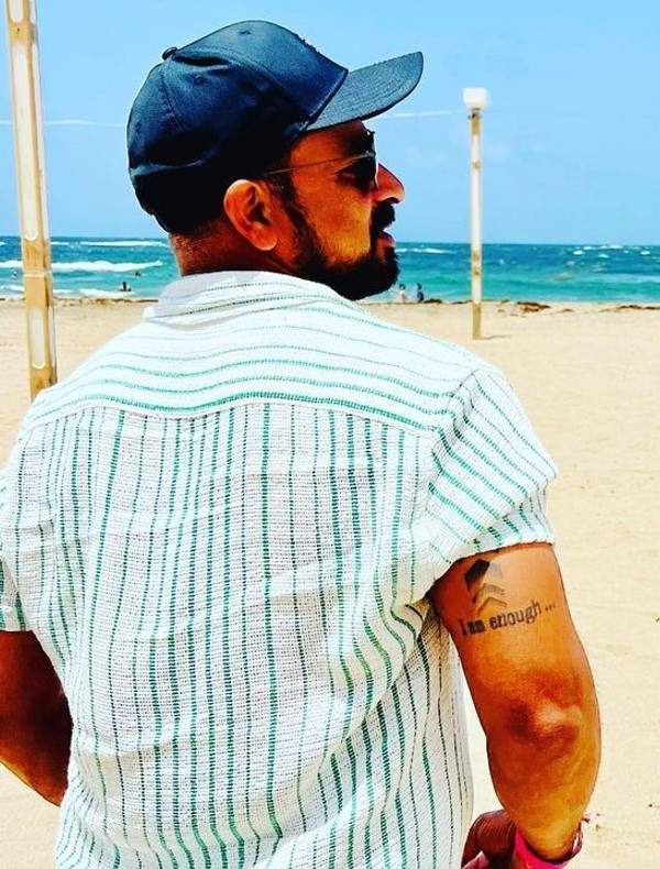 'I am enough' tattoo on T Dilip's arm