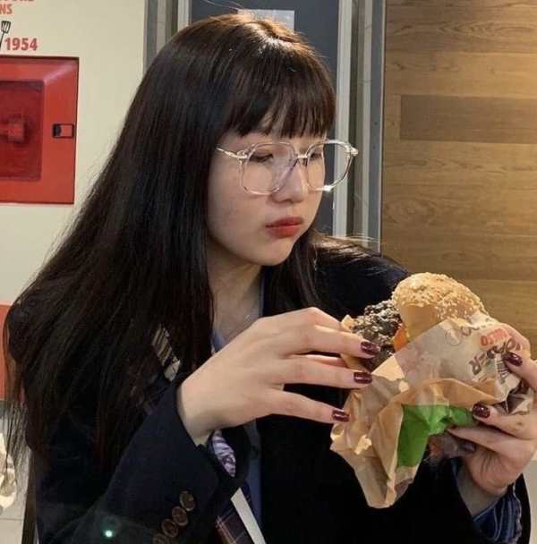 Joy having a non-vegetarian burger