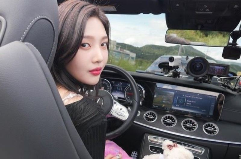 Joy while driving her car