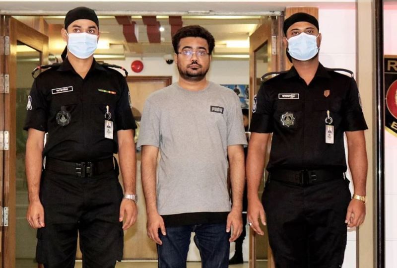 Mohammad Ziauddin Rufi (centre) arrested by police
