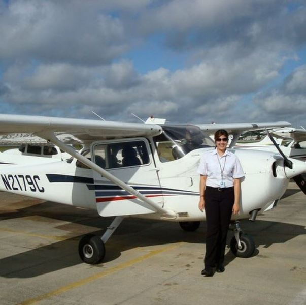 Neha Anand standing in front of Cessna aircraft