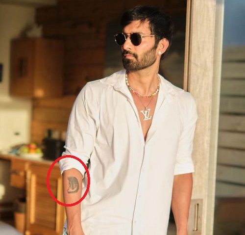 Nishank Swami's tattoo of Alphabet ‘D’ on his left forearm