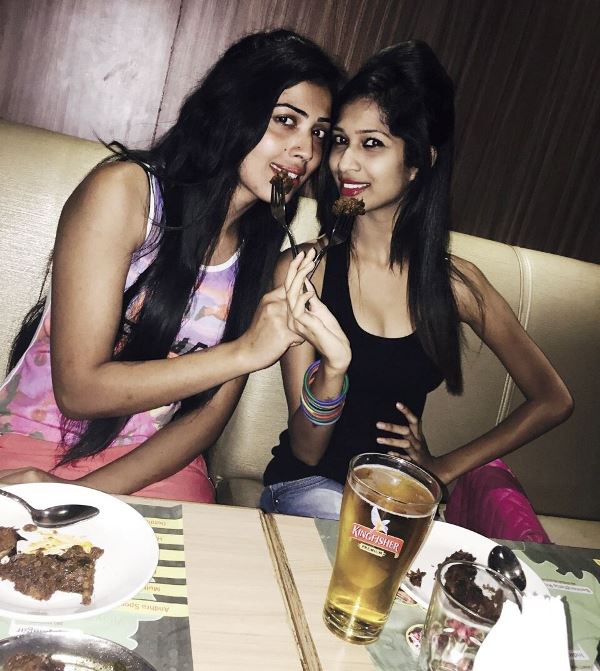 Pavi Poovappa enjoying beer with a friend