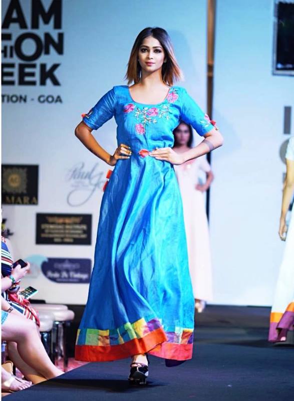 Pavi Poovappa walking the ramp at India Glam Fashion Week 2019
