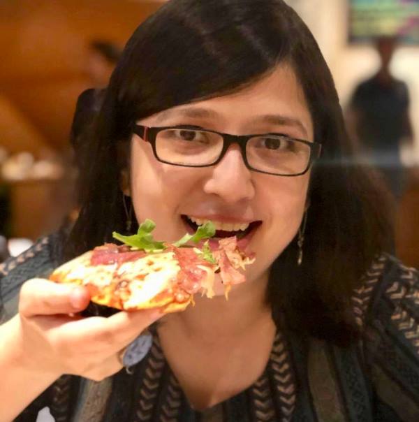 Piyu Chakraborty eating a non-vegetarian pizza
