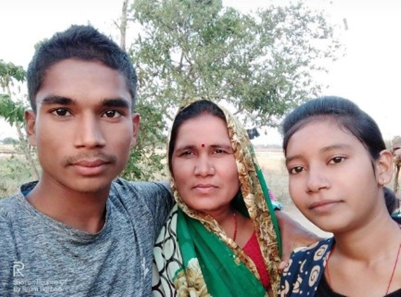 Ram Baboo with his sister and mother