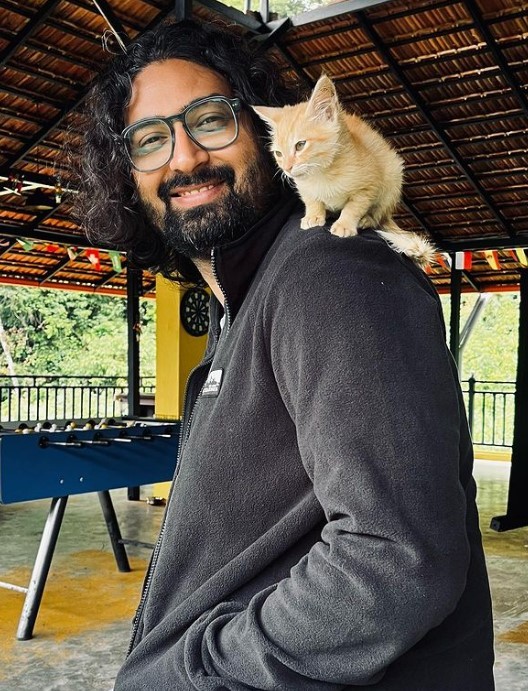 Ravi Gupta playing with a cat