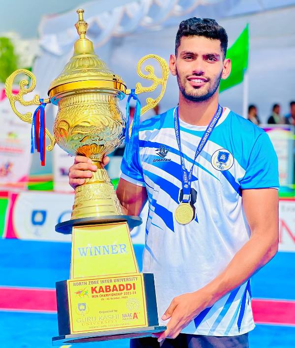 Sagar Rathee with the North Zone Inter University Kabaddi Men's Championship trophy