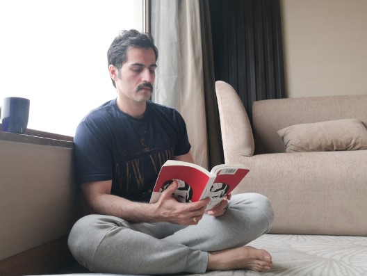 Sajjad Delafrooz while reading a book