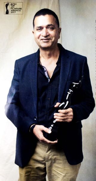 Sham Kaushal posing with the Best Action award that he received at the 2017 Filmfare Awards