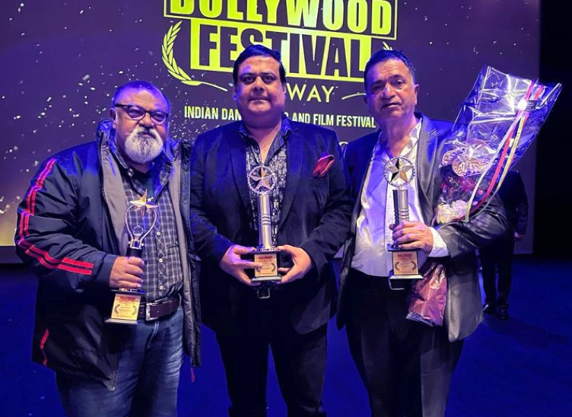 Sham Kaushal (right) posing with his Lifetime Achievement Award at the 20th Bollywood Festival, in Norway