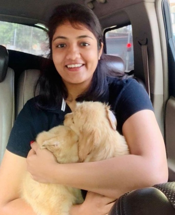 Shivani Pruthvi playing with her dogs