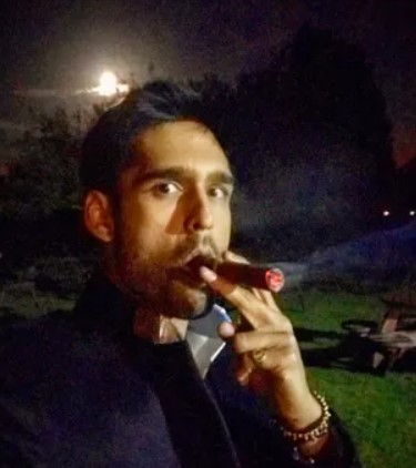 Siddharth Mallya while smoking a cigar