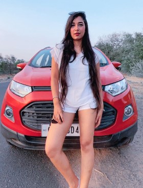 Swati Asthana posing with her Ford Eco Sport