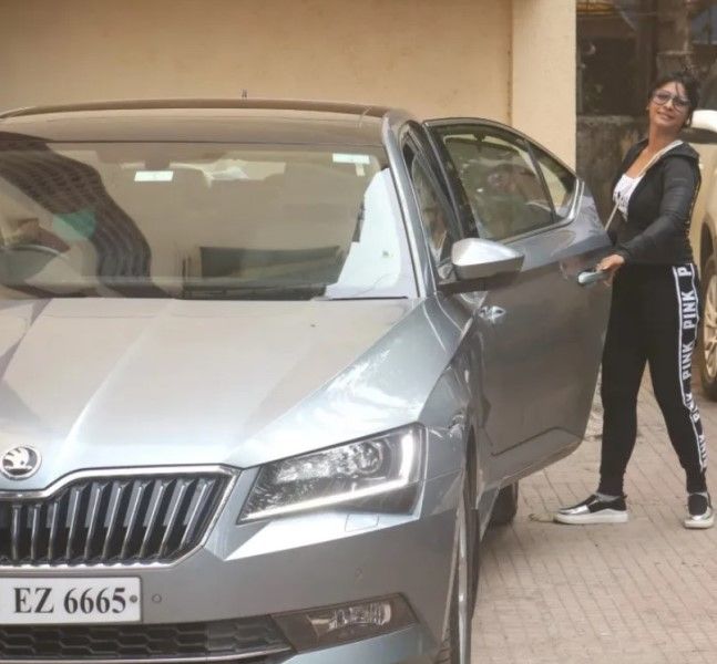 Tanisha Mukerji with getting in her Skoda Superb car