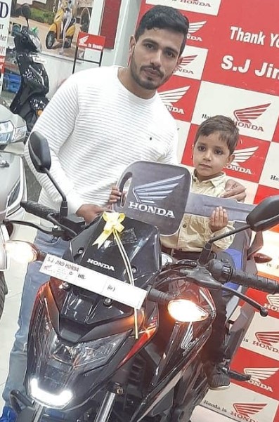 Vikash Kandola posing with his bike