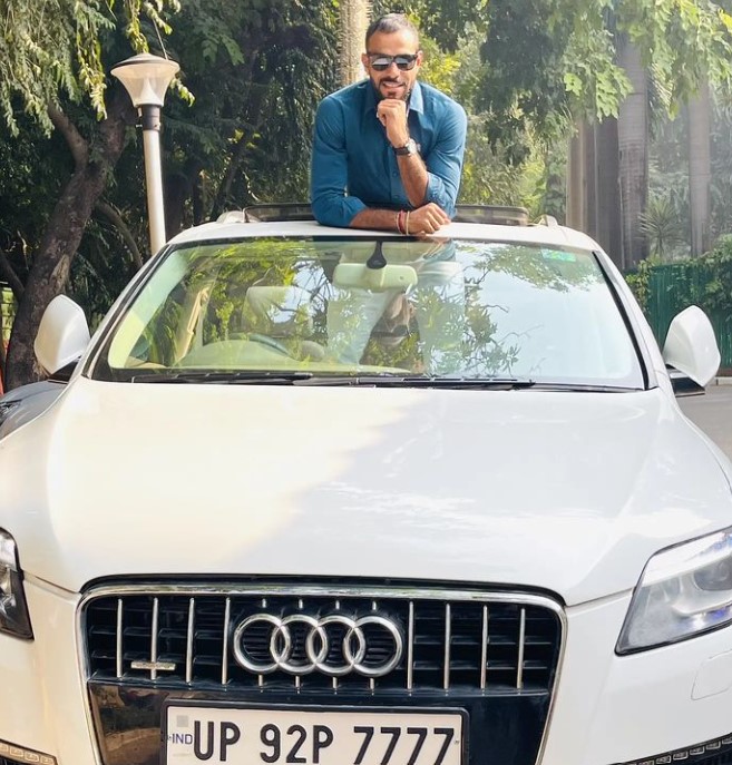 Abhishek Singh Thakur posing with his Audi