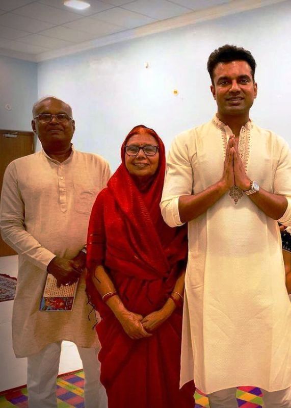 Abhishek Singh with his father and mother during a festivity