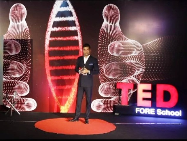 Abhishek giving a speech at TEDxFORESchool in 2022