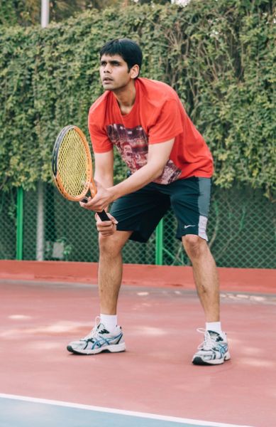 Abhyuday Jindal playing tennis, his favourite sport
