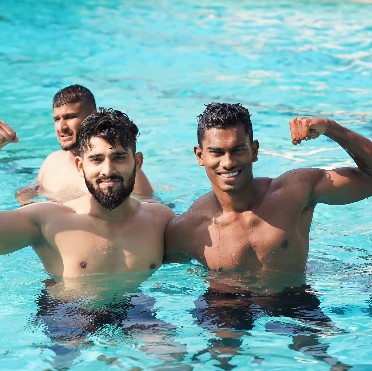 Aditya S Shinde while enjoying swimming with his teammates
