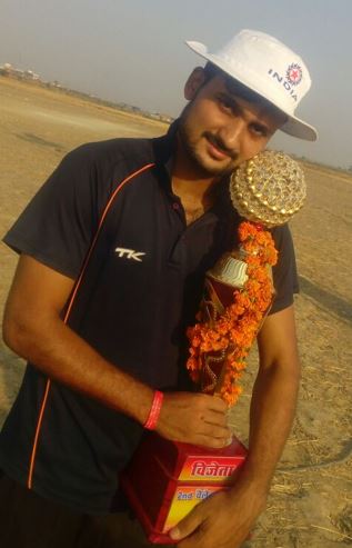 Akash Deep holding a trophy after winning a tournament