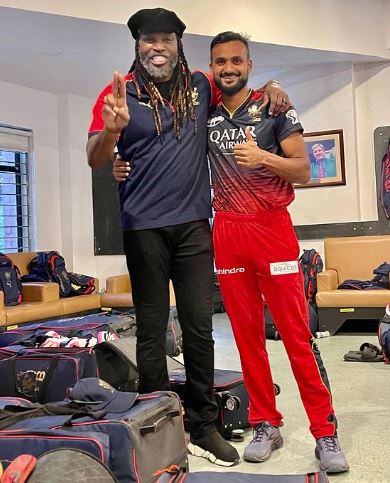 Akash Deep with Chris Gayle (left) during IPL season