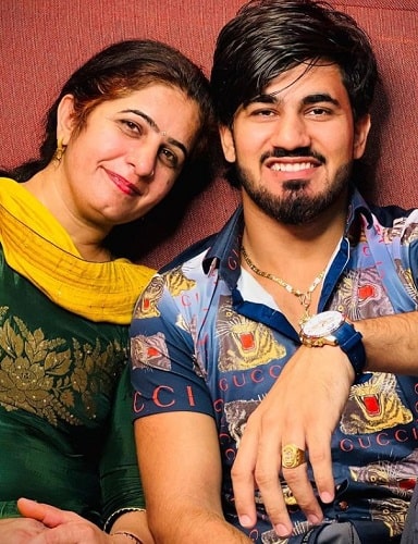 Aman Jaji with his mother