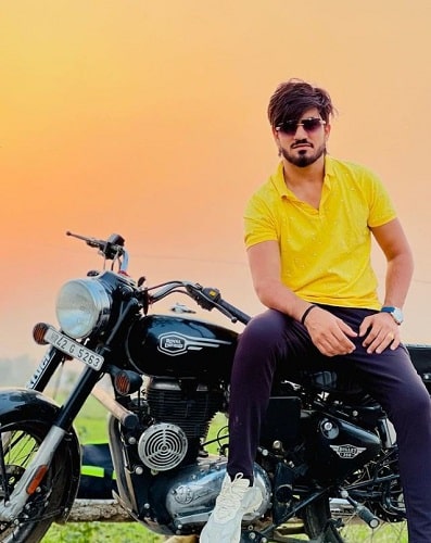 Aman Jaji with his motorcycle