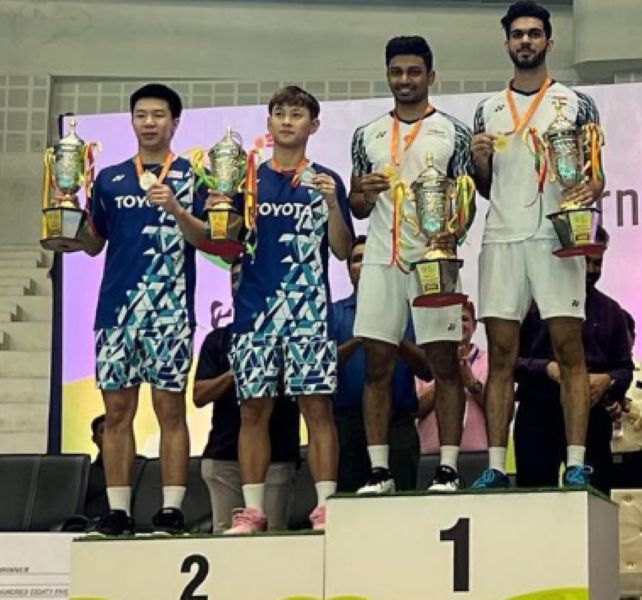 Arjun M. R. (second from right) after his men's double win at the 2022 India International Challenge