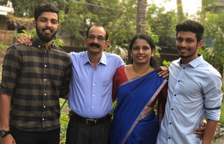 Arjun M. R. (extreme right) with his parents and brother