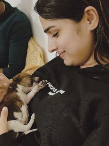 Ayesha Khan with a puppy
