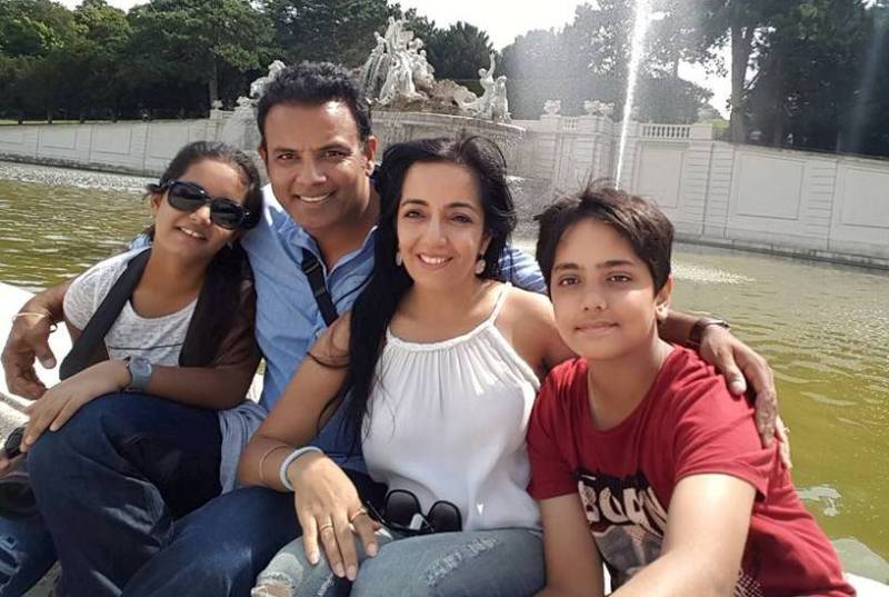Bhupinder Singh with his wife and children