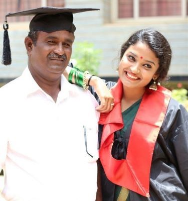 Chaithra J Achar with her father on her graduation