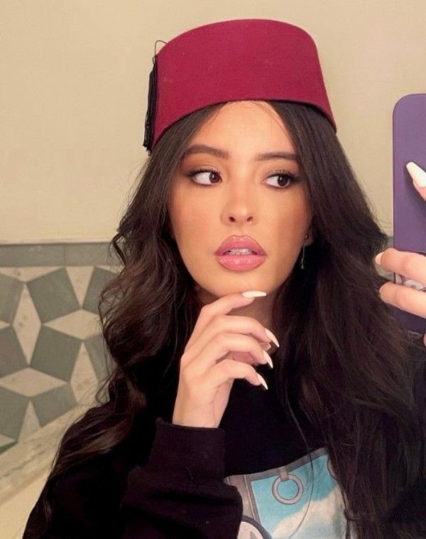 Faouzia wearing a Moroccan cap