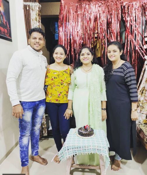 Girish Maruti Ernak (extreme left) with his wife (second from left) and sisters