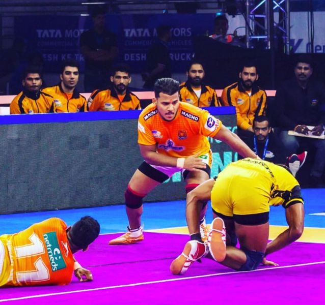 Girish Maruti Ernak (in orange) during a match representing the team 'Puneri Paltan'