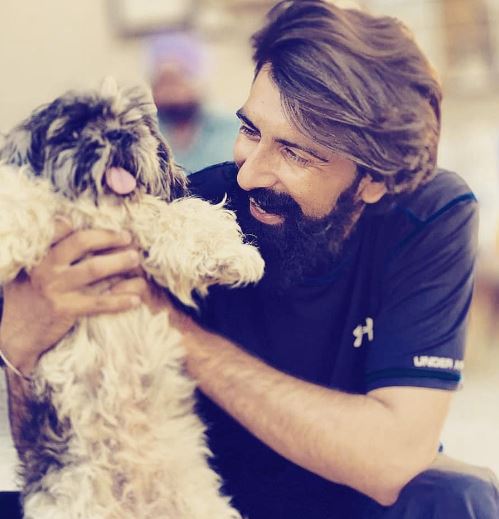 Gursewak Singh Mander with a dog