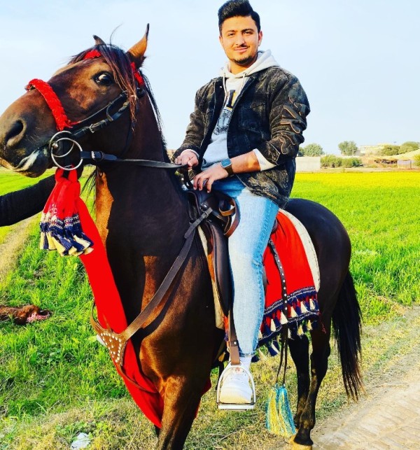 Hamza Saleem Dar riding a horse