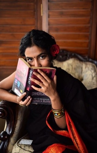 Himika Bose reading a book